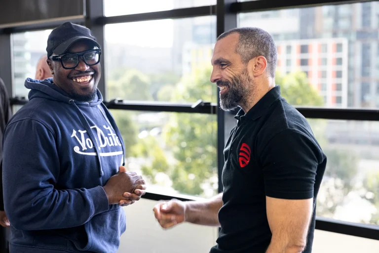 Stand2 trainer and client smiling