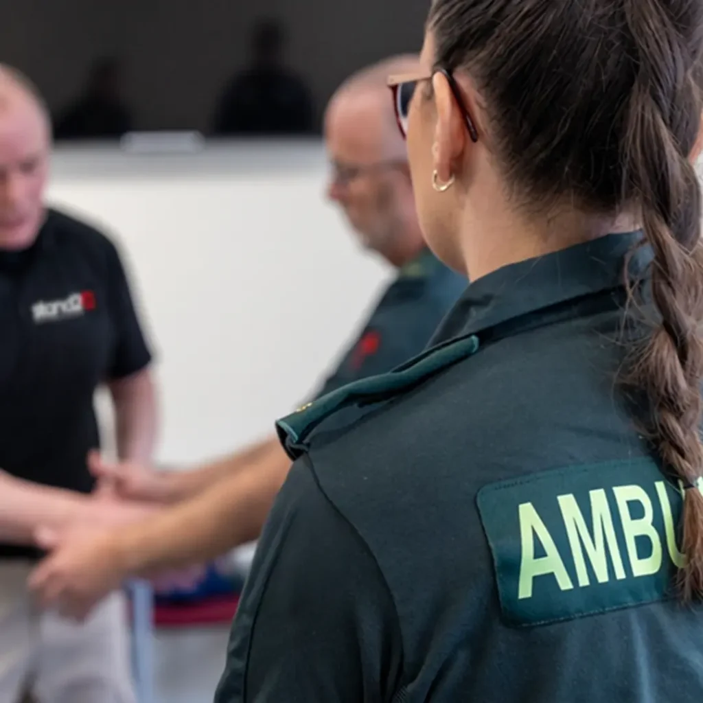 Paramedic standing with a Stand2 trainer