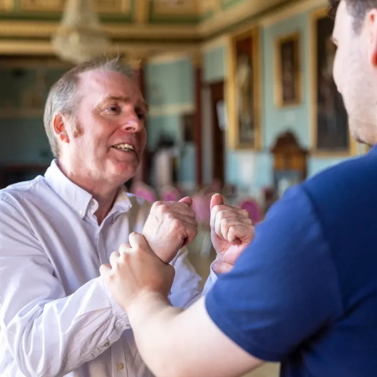 Grabbing a man's wrists during training