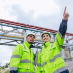 Engineer oil and gas refinery pipe service team worker working together in petroleum pipeline industry.