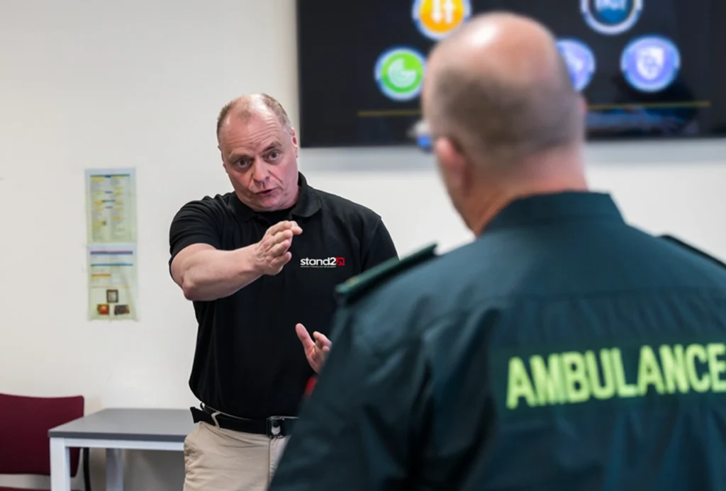 Man pointing at paramedic