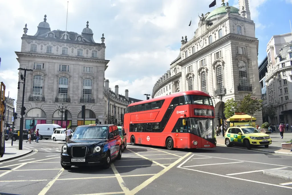 A London bus driving through a junction